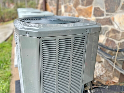 An AC in the backyard of a Belchertown, MA home